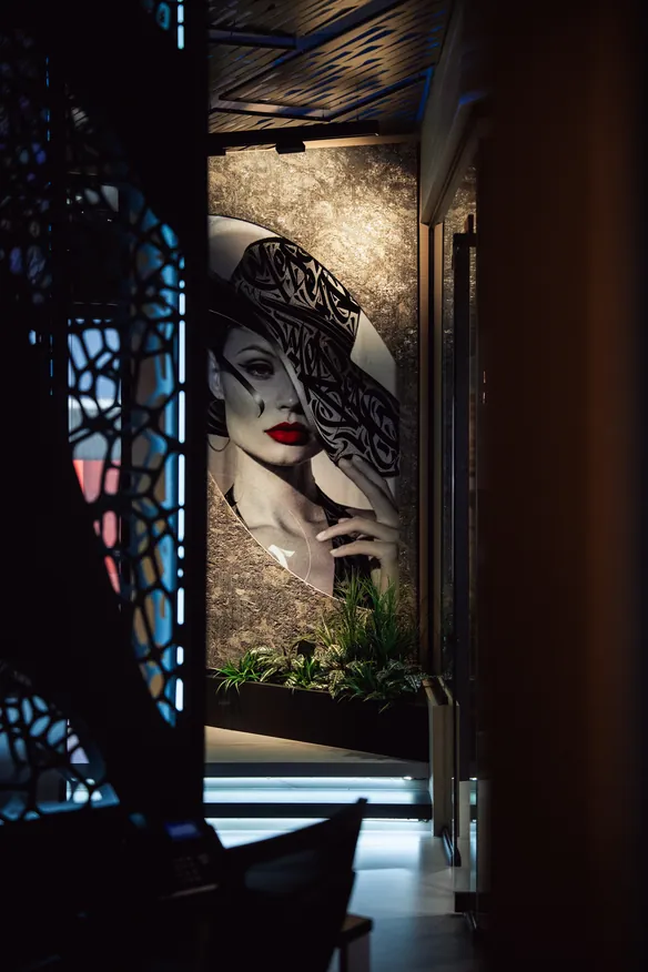 A printed portrait framed by Kosmus — the setting becomes the subject.