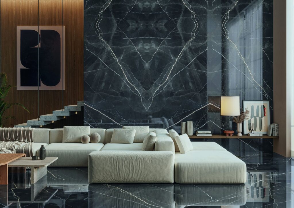 A dark, atmospheric living room with a sintered marble feature wall