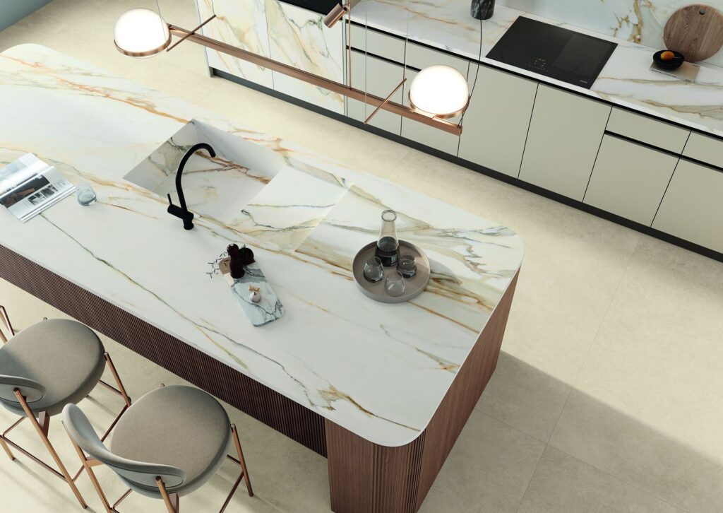 A kitchen with a fabricated waterfall-edge sintered stone countertop