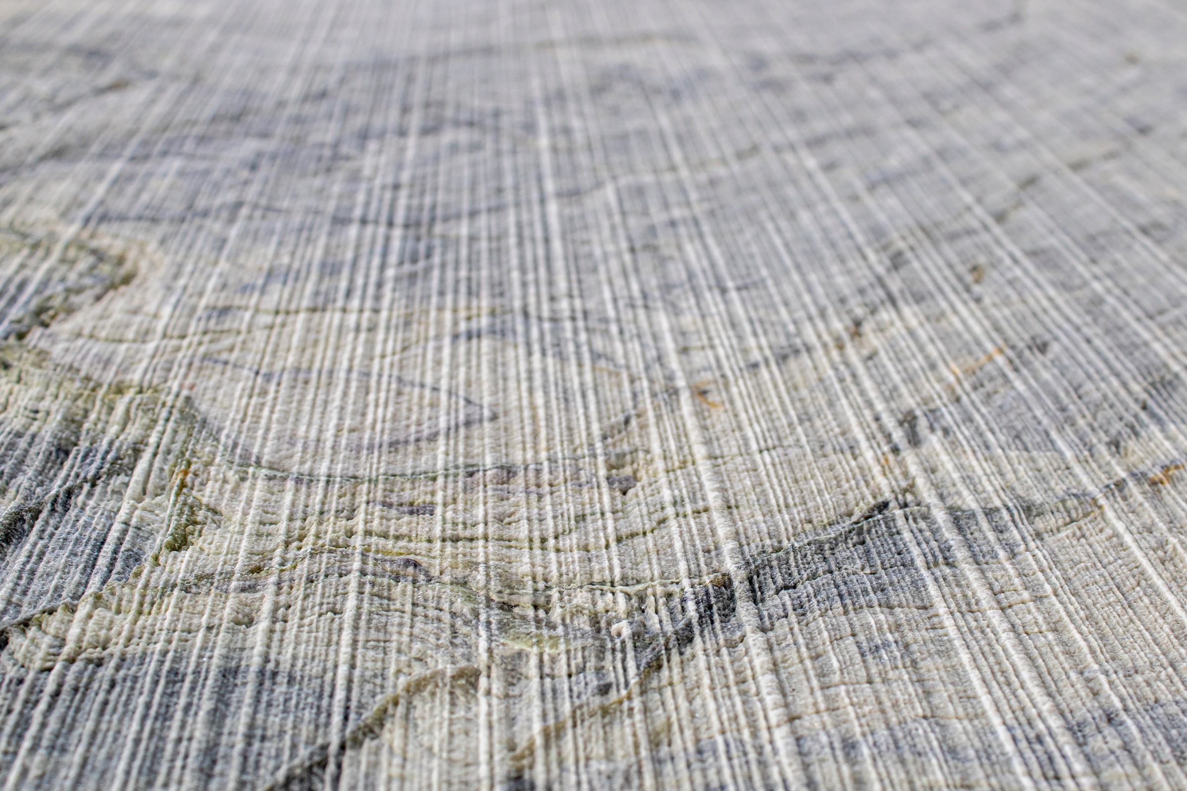 Textured stone island face and waterfall